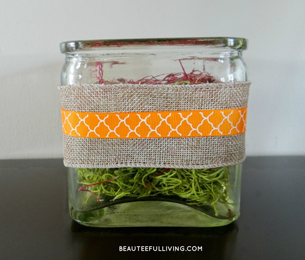 Burlap and ribbon wrapped container